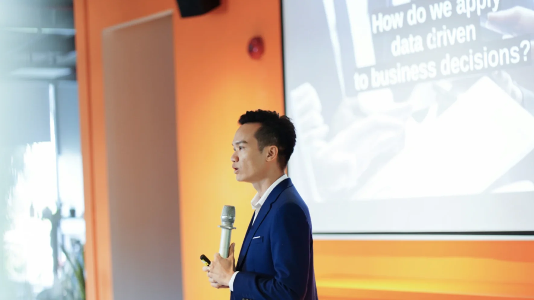 Executive speaking during a business presentation.