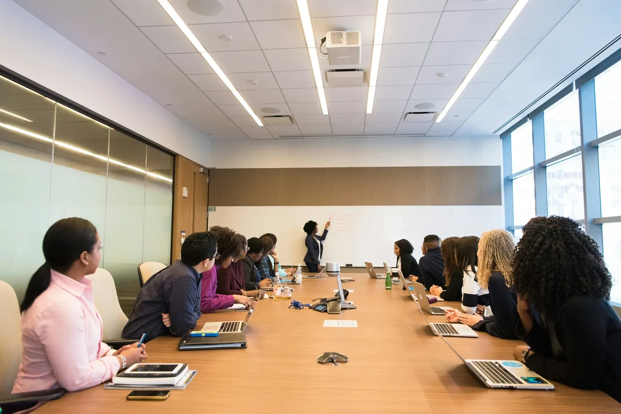 Leadership team reviewing a presentation in a conference room.